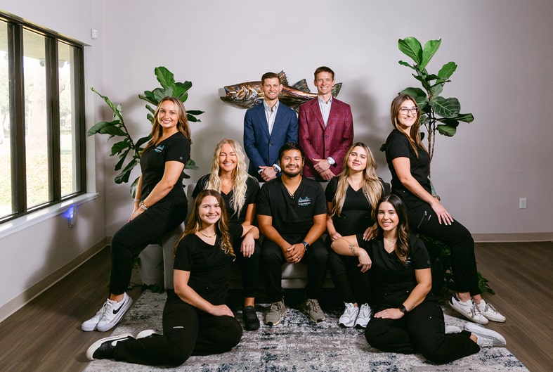 Our Dedicated Team: Your Partner in Orthodontic Success. Amley McEntire Orthodontics team all smiling