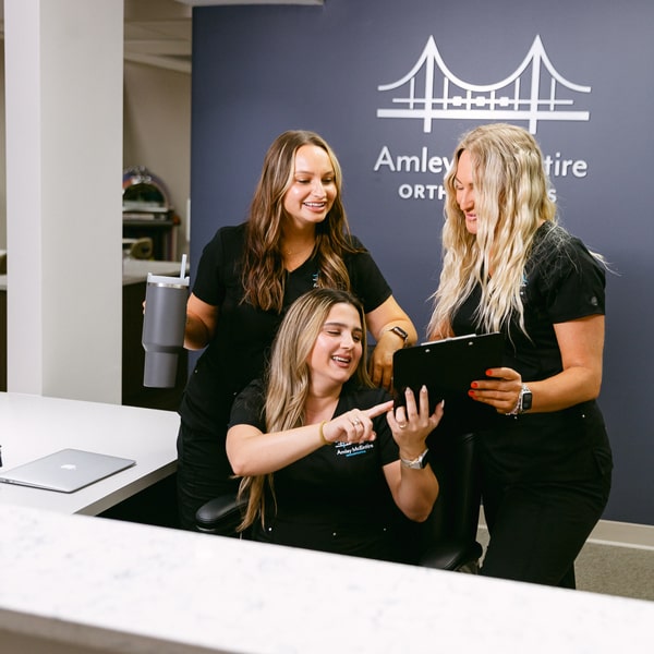 Amley McEntire team is happily smiling